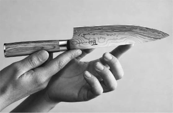 Inspecting a SYOKAMI blade by hand