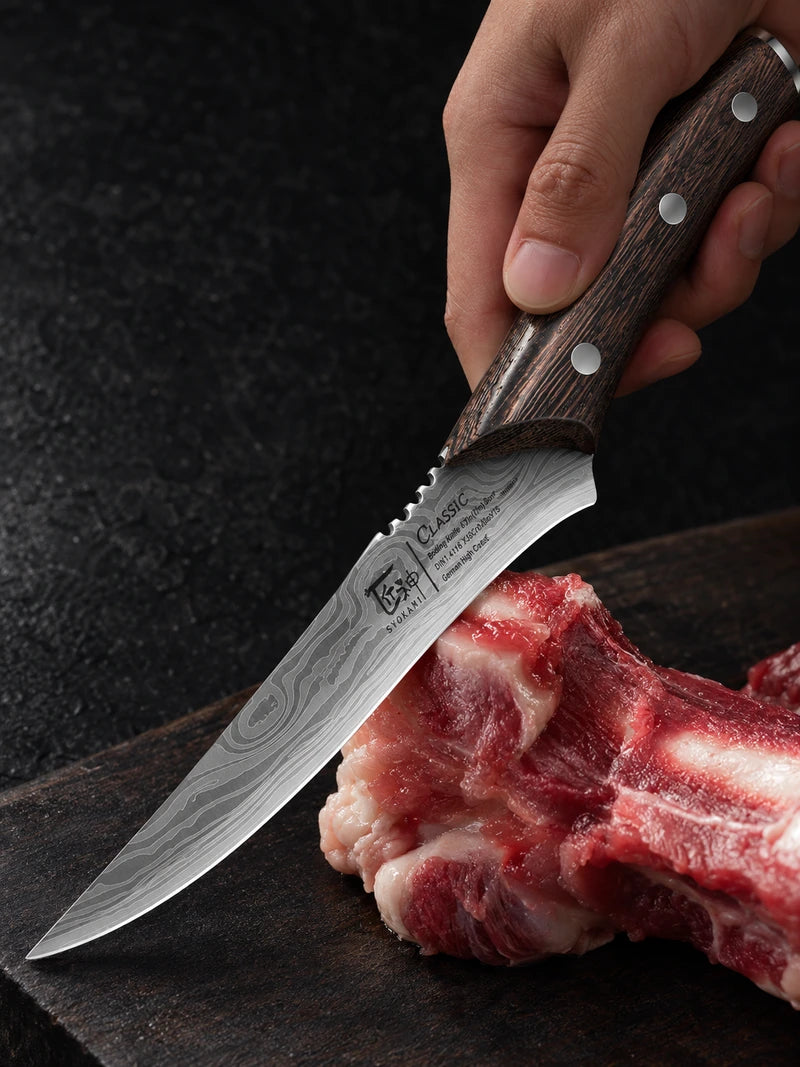 Close view of the boning knife blade root, rounded spine notches, dark wooden grip and physical SYOKAMI and CLASSIC markings