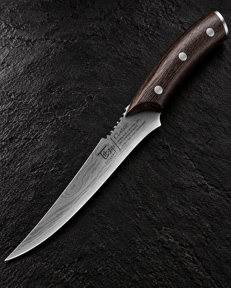 Complete pointed curved boning knife on textured black stone showing three silver rivets, dark wooden handle and metal rear cap