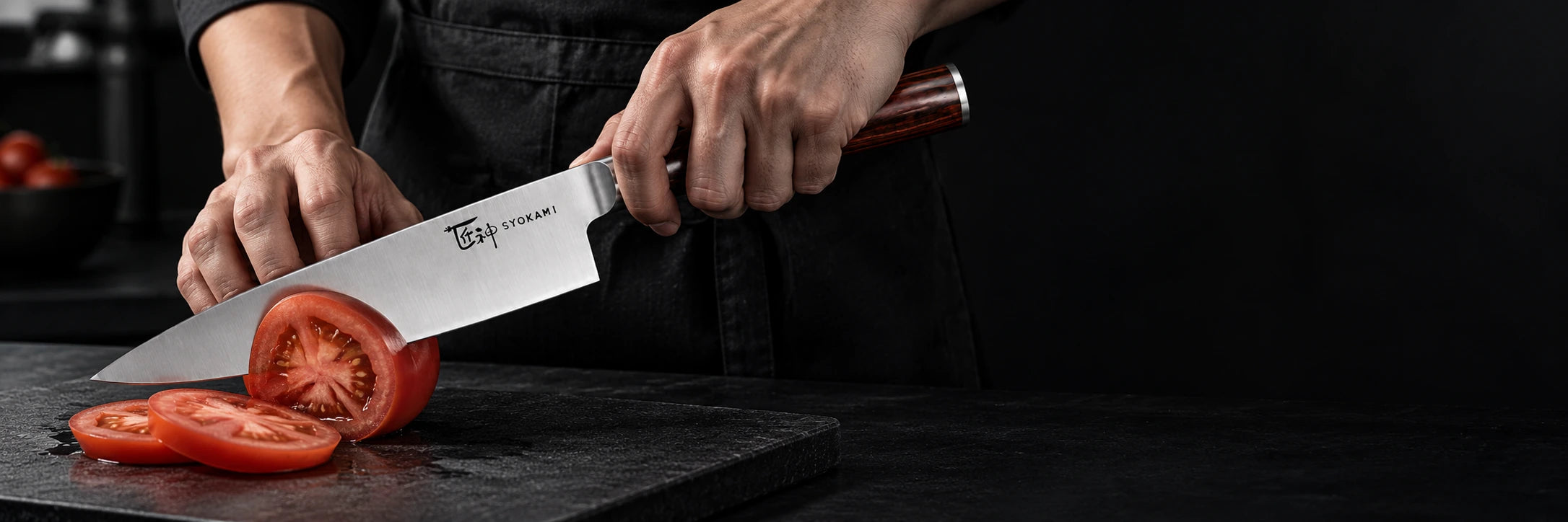 A SYOKAMI 8-inch chef knife slicing a tomato on a dark cutting board